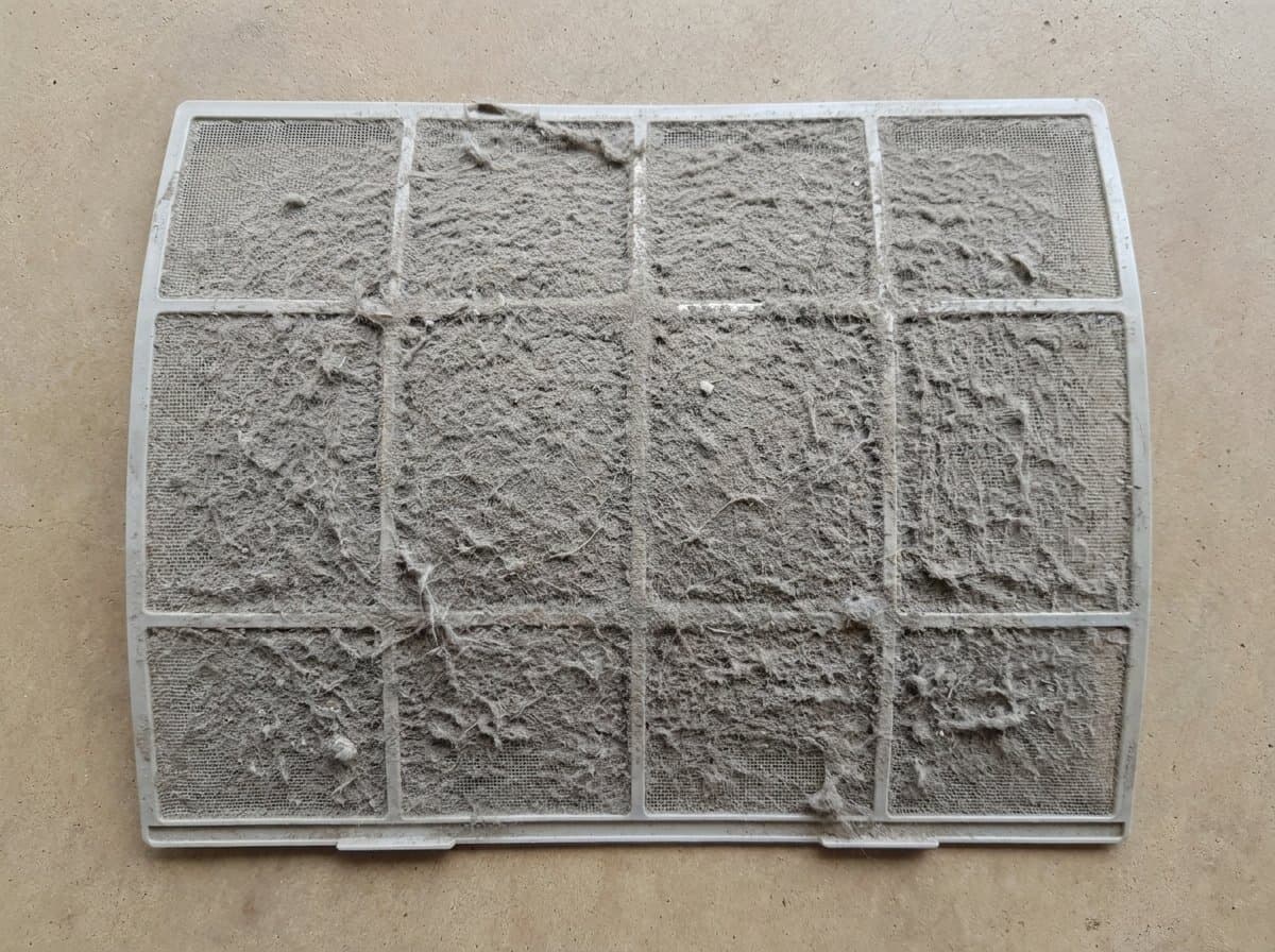 AC filter before and after washing, dust and lint cleared for better airflow