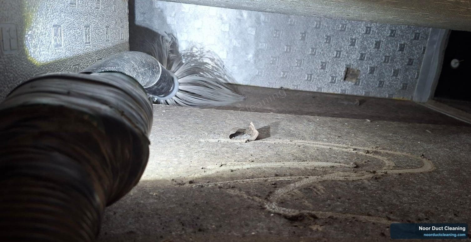 AC duct interior before and after deep cleaning in Sharjah, heavy dust removed with a rotobrush machine