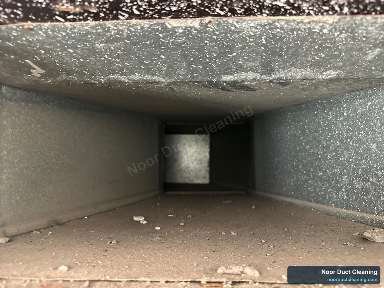 Blocked, dusty AC duct before and after cleaning, airflow restored