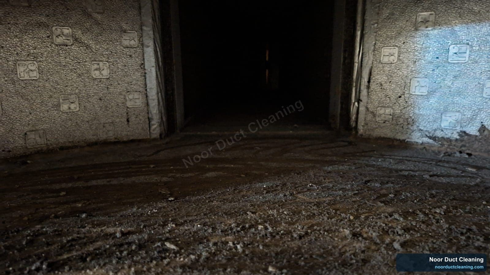 Dubai AC duct before and after cleaning, dark settled dust along a long duct run brushed and vacuumed away