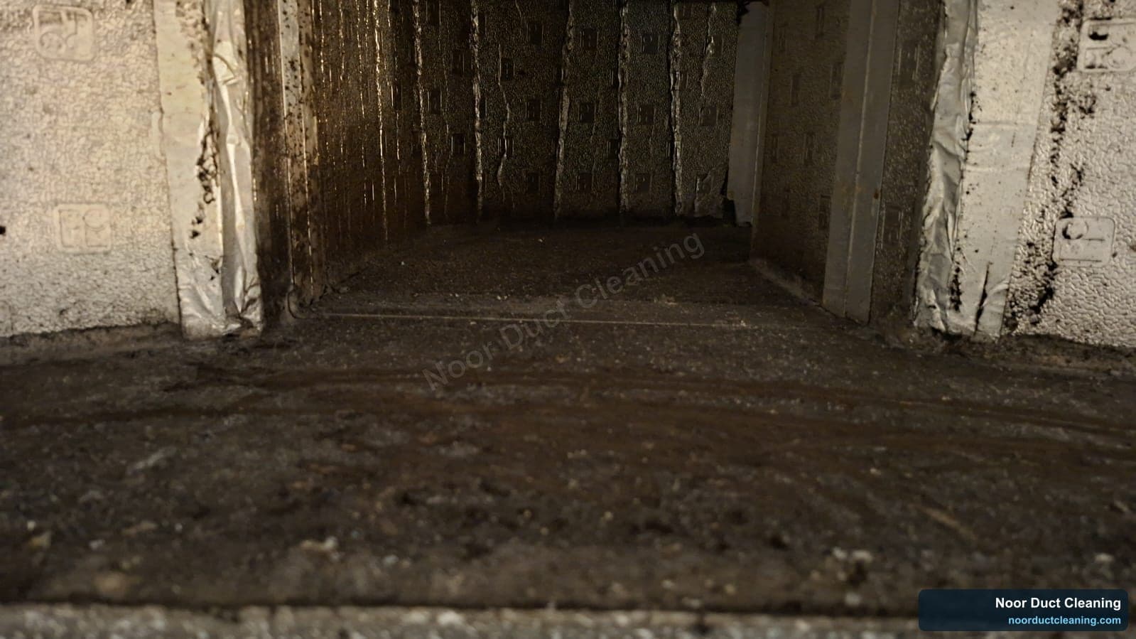Heavily soiled AC duct on a Dubai job before and after cleaning, caked dust and grime removed from the duct wall
