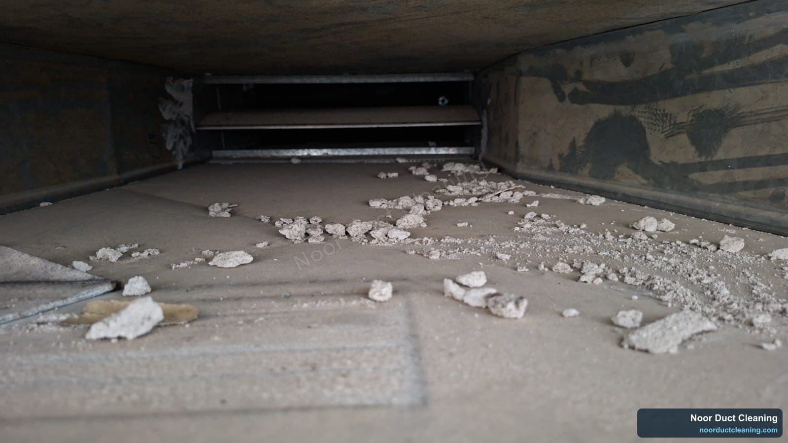 Dubai AC duct before and after cleaning, chunks of construction rubble and dust removed from the duct floor