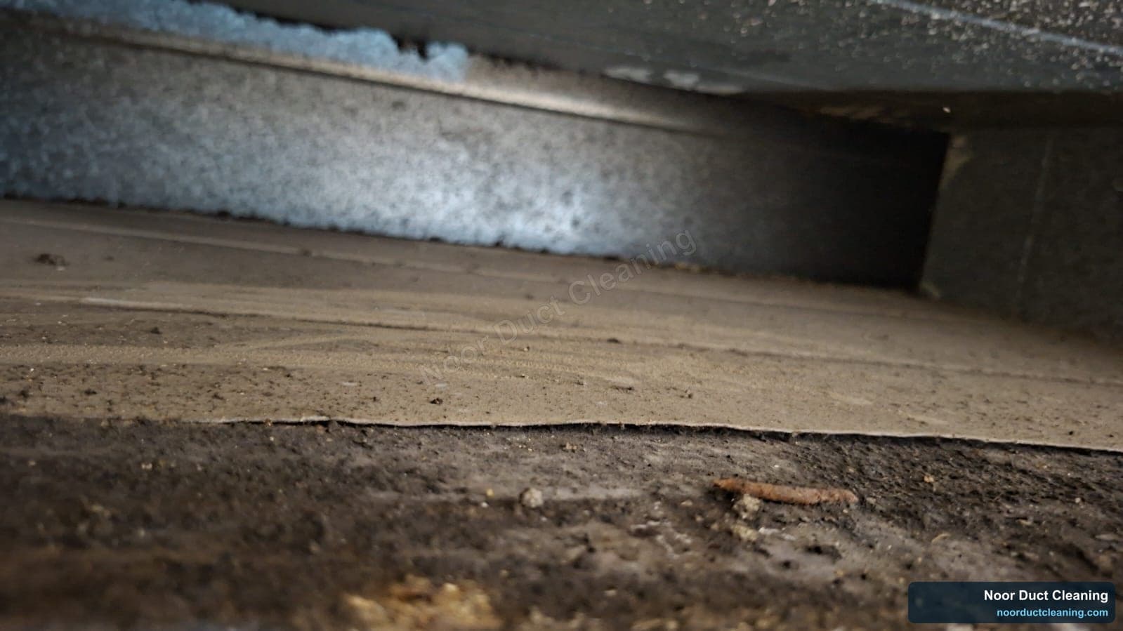 Long AC duct run in a Dubai property before and after cleaning, settled dust removed to restore clean galvanised metal