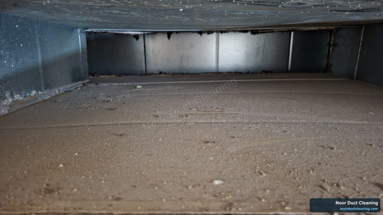 Dubai AC duct before and after cleaning, a film of dust on the duct floor lifted to leave clean, bright metal
